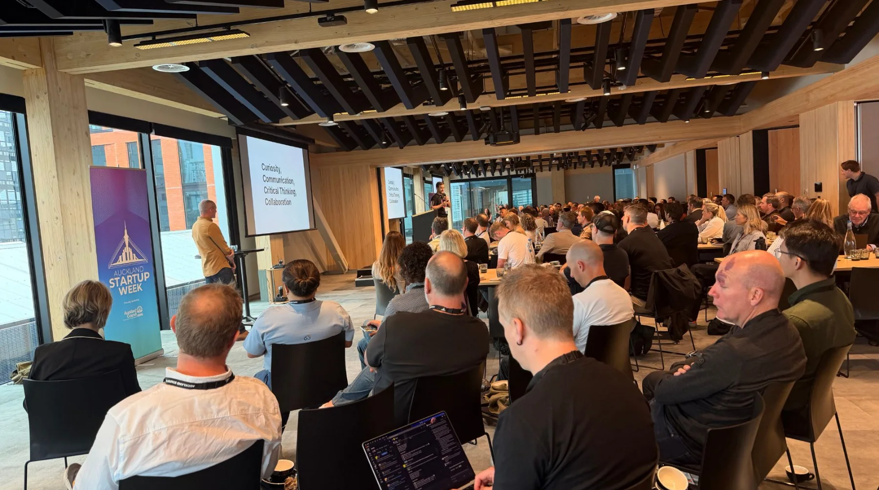 The SaaSpocalypse Now session at Auckland Startup Week, with Curiosity, Communication, Critical Thinking and Collaboration on the screen